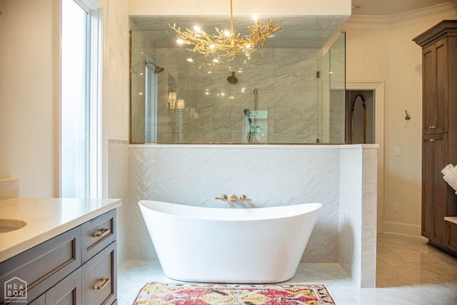 1203 Dove Rd, Jonesboro, AR 72401 - bathroom featuring a freestanding tub, a shower with shower door, a chandelier, and vanity