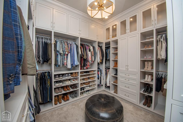 1203 Dove Rd, Jonesboro, AR 72401 - spacious closet featuring an inviting chandelier and carpet floors