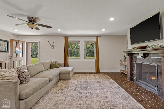 1766 Greene Road 326, Bono, AR 72416 - living room featuring a fireplace, plenty of natural light, wood finished floors, a ceiling fan, and recessed lighting
