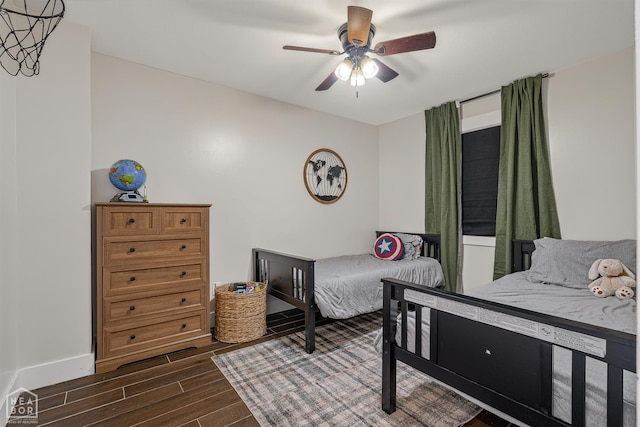 1766 Greene Road 326, Bono, AR 72416 - bedroom featuring dark wood-type flooring, a ceiling fan, and baseboards