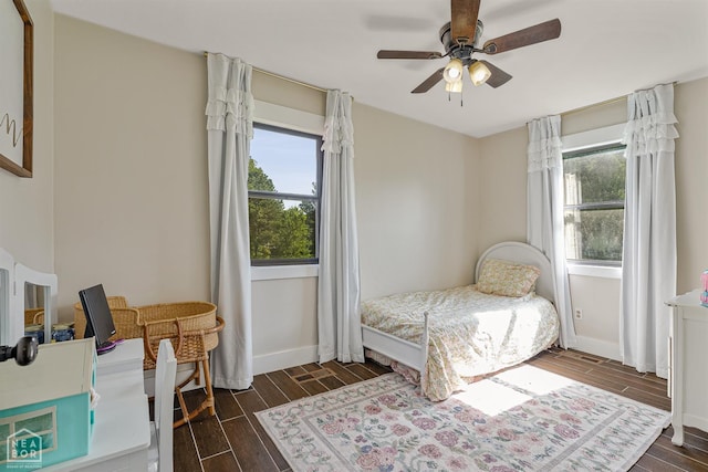 1766 Greene Road 326, Bono, AR 72416 - bedroom featuring dark wood-style floors, baseboards, and ceiling fan