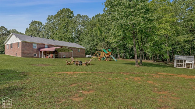 1766 Greene Road 326, Bono, AR 72416 - view of green lawn featuring a playground and a detached carport