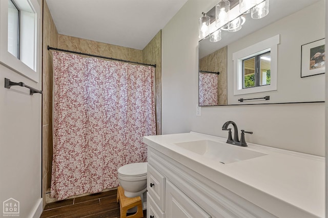 1766 Greene Road 326, Bono, AR 72416 - full bath with wood finished floors, vanity, toilet, and a shower with curtain