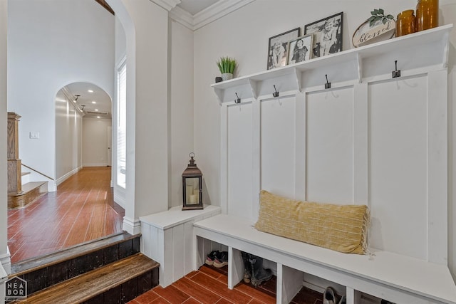 1616 Neely Rd, Jonesboro, AR 72404 - mudroom featuring arched walkways, dark wood-style floors, and ornamental molding
