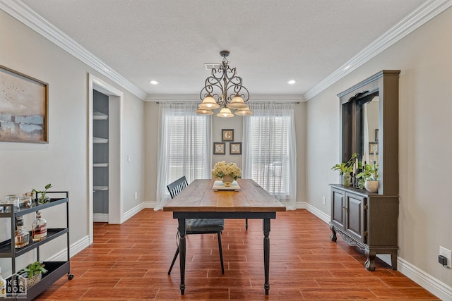1616 Neely Rd, Jonesboro, AR 72404 - dining space featuring an inviting chandelier, ornamental molding, wood finished floors, and a textured ceiling