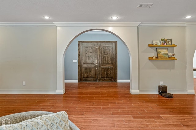 1616 Neely Rd, Jonesboro, AR 72404 - foyer entrance with wood finished floors, arched walkways, baseboards, visible vents, and recessed lighting