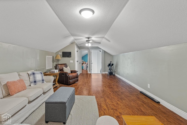 1616 Neely Rd, Jonesboro, AR 72404 - living area with vaulted ceiling, wood finished floors, baseboards, a textured ceiling, and ceiling fan