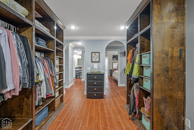 1616 Neely Rd, Jonesboro, AR 72404 - walk in closet featuring wood finished floors and arched walkways