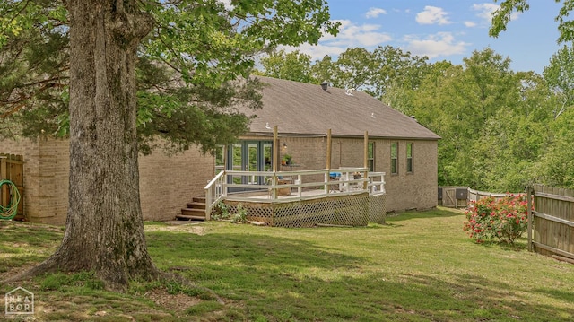 1616 Neely Rd, Jonesboro, AR 72404 - rear view of property featuring brick siding, a yard, a wooden deck, and fence