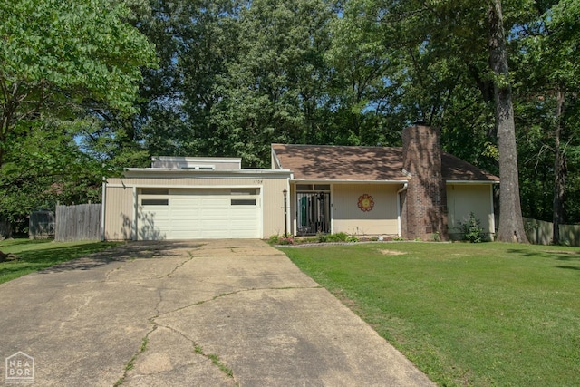 1705 Loberg Ln, Jonesboro, AR 72401 - mid-century inspired home featuring concrete driveway, an attached garage, and a chimney
