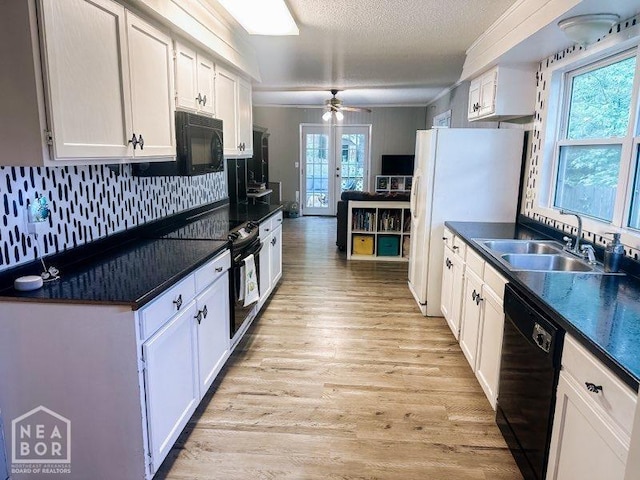 1705 Loberg Ln, Jonesboro, AR 72401 - kitchen featuring black appliances, a sink, dark countertops, a ceiling fan, and crown molding