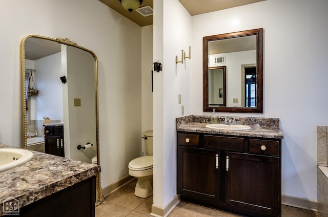 103 Hollis Cv, Bono, AR 72416 - full bathroom featuring toilet, two vanities, baseboards, and tile patterned floors