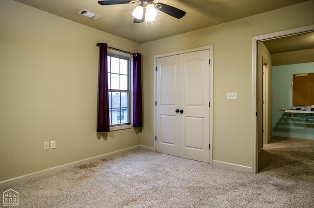 103 Hollis Cv, Bono, AR 72416 - unfurnished bedroom featuring carpet floors, baseboards, a closet, and a ceiling fan
