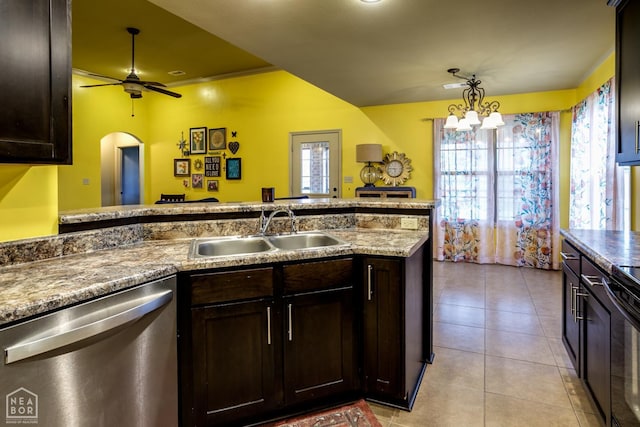 103 Hollis Cv, Bono, AR 72416 - kitchen with stainless steel dishwasher, a sink, dark brown cabinetry, a ceiling fan, and light tile patterned floors