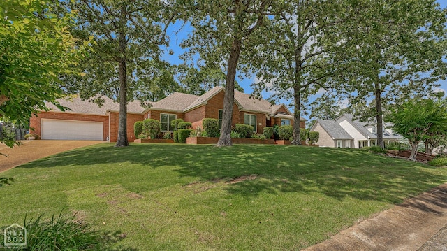 2304 Autumn Dr, Jonesboro, AR 72404 - view of front of house with brick siding, a front lawn, a garage, and concrete driveway