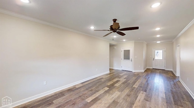 spare room with ceiling fan, ornamental molding, recessed lighting, dark wood-style flooring, and baseboards