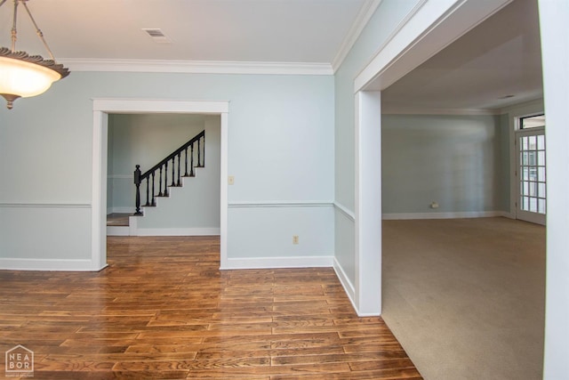 2205 Oak Hollow Ln, Jonesboro, AR 72401 - spare room with ornamental molding, stairs, and wood finished floors