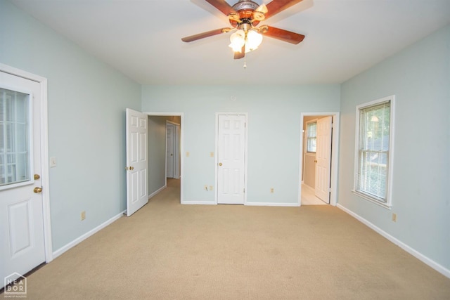 2205 Oak Hollow Ln, Jonesboro, AR 72401 - unfurnished bedroom with light colored carpet, a ceiling fan, and connected bathroom