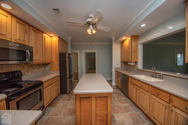 2205 Oak Hollow Ln, Jonesboro, AR 72401 - kitchen featuring appliances with stainless steel finishes, a center island, ceiling fan, tasteful backsplash, and ornamental molding