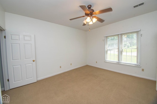 2205 Oak Hollow Ln, Jonesboro, AR 72401 - unfurnished room with light carpet and ceiling fan