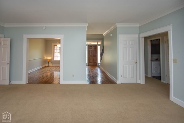 2205 Oak Hollow Ln, Jonesboro, AR 72401 - carpeted empty room featuring crown molding and wood finished floors