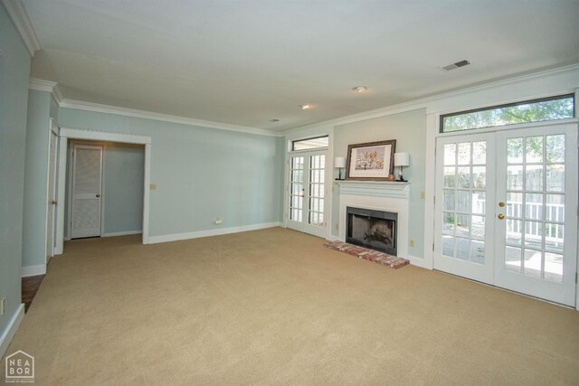 2205 Oak Hollow Ln, Jonesboro, AR 72401 - unfurnished living room featuring ornamental molding, carpet, french doors, a fireplace, and recessed lighting