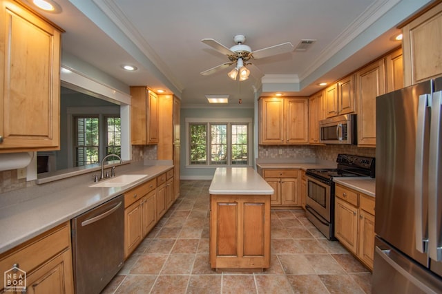 2205 Oak Hollow Ln, Jonesboro, AR 72401 - kitchen with appliances with stainless steel finishes, crown molding, a kitchen island, tasteful backsplash, and a ceiling fan