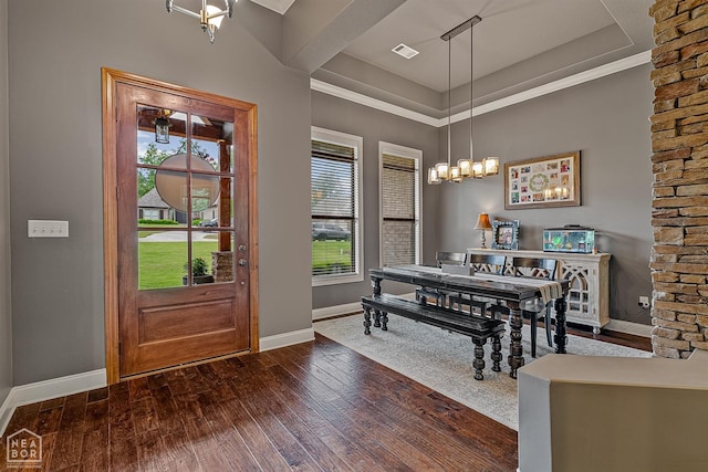 dining area featuring baseboards and hardwood / wood-style flooring
