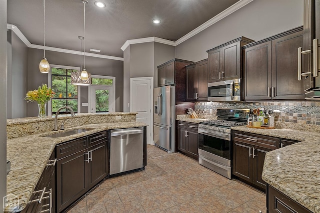 kitchen with stainless steel appliances, a sink, decorative backsplash, dark brown cabinetry, and light stone countertops