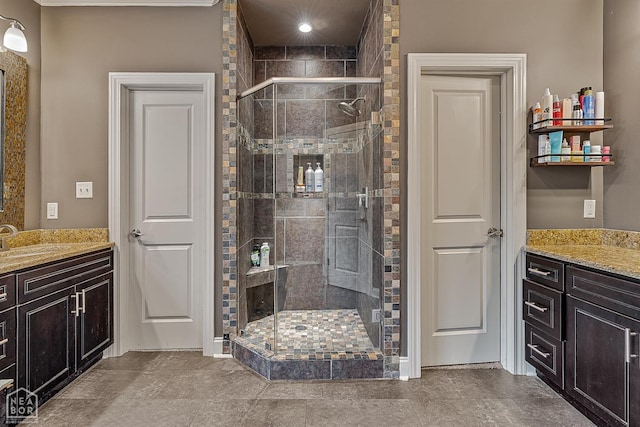 bathroom with a stall shower and vanity