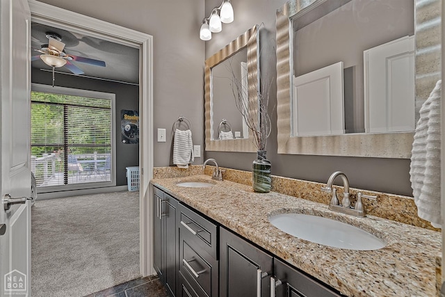 bathroom featuring double vanity, ceiling fan, and tile patterned floors