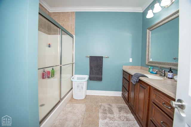 bathroom with a shower stall, tile patterned floors, vanity, and ornamental molding