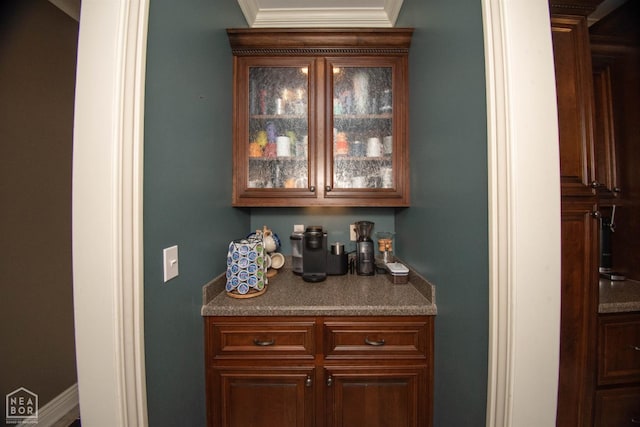 bar featuring crown molding