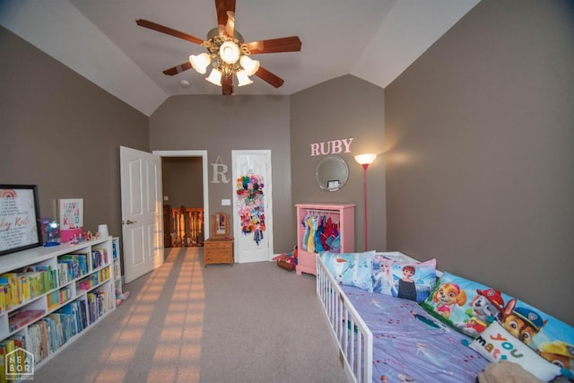 bedroom featuring carpet, vaulted ceiling, and a ceiling fan