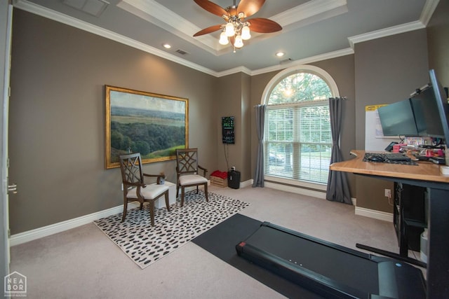 workout room with ornamental molding, a ceiling fan, carpet floors, visible vents, and a tray ceiling