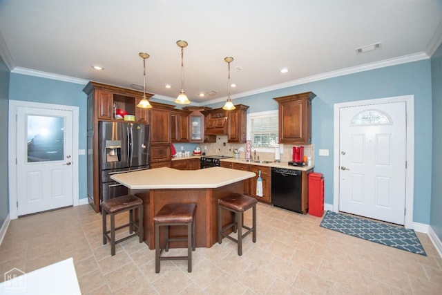 kitchen with visible vents, light countertops, black appliances, backsplash, and a breakfast bar area