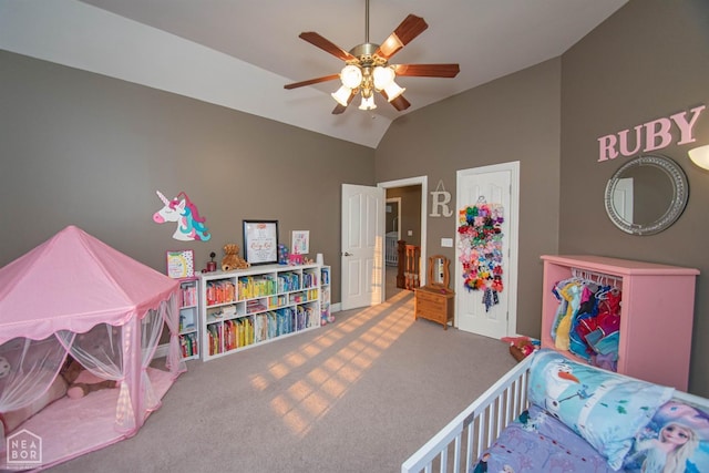 carpeted bedroom featuring ceiling fan and vaulted ceiling