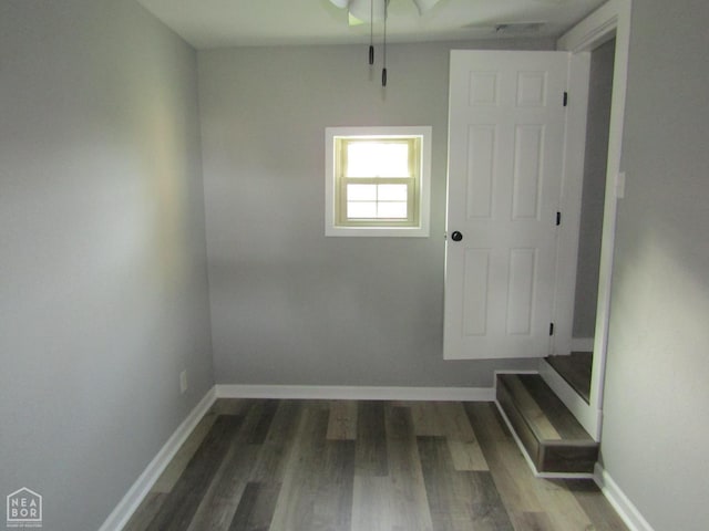 203 N 1st St, Marmaduke, AR 72443 - unfurnished dining area featuring wood finished floors, baseboards, and a ceiling fan