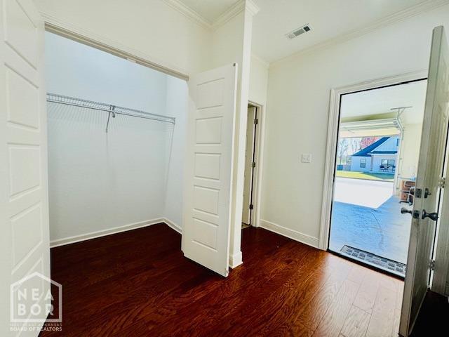 3803 Stone Ridge Dr, Paragould, AR 72450 - unfurnished bedroom featuring dark wood-style floors, crown molding, access to outside, baseboards, and a closet