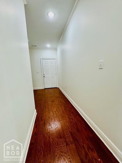 3803 Stone Ridge Dr, Paragould, AR 72450 - corridor with crown molding, dark wood-type flooring, and baseboards