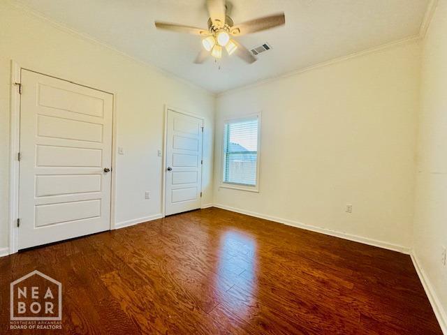 3803 Stone Ridge Dr, Paragould, AR 72450 - unfurnished bedroom featuring wood finished floors, crown molding, baseboards, and a ceiling fan