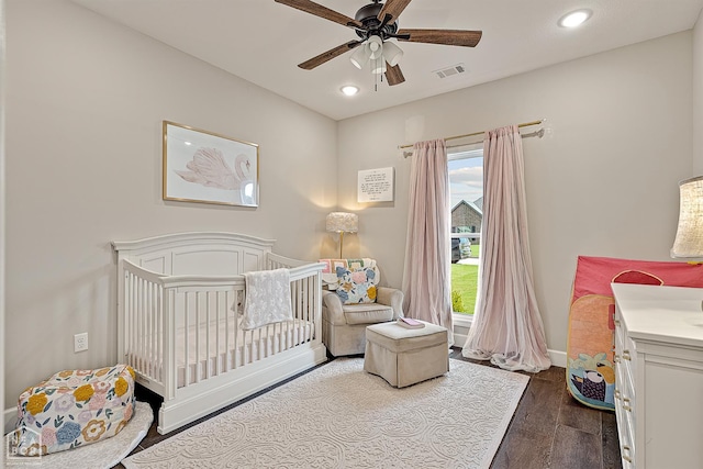 3604 Fieldstone Dr, Paragould, AR 72450 - bedroom with a crib, dark wood finished floors, recessed lighting, and a ceiling fan