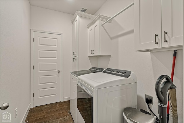 3604 Fieldstone Dr, Paragould, AR 72450 - laundry area featuring cabinet space, washing machine and dryer, and dark wood-type flooring