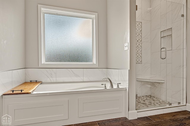 3604 Fieldstone Dr, Paragould, AR 72450 - full bath with plenty of natural light, a shower stall, a garden tub, and tile walls