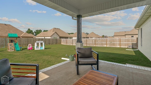 3604 Fieldstone Dr, Paragould, AR 72450 - fenced backyard with a patio and a playground