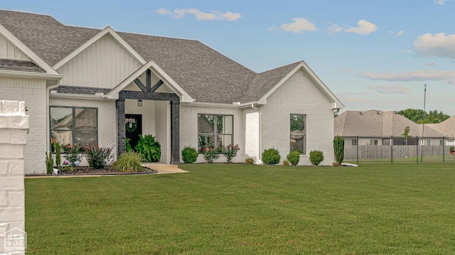 3604 Fieldstone Dr, Paragould, AR 72450 - view of front of property with board and batten siding, brick siding, and a shingled roof