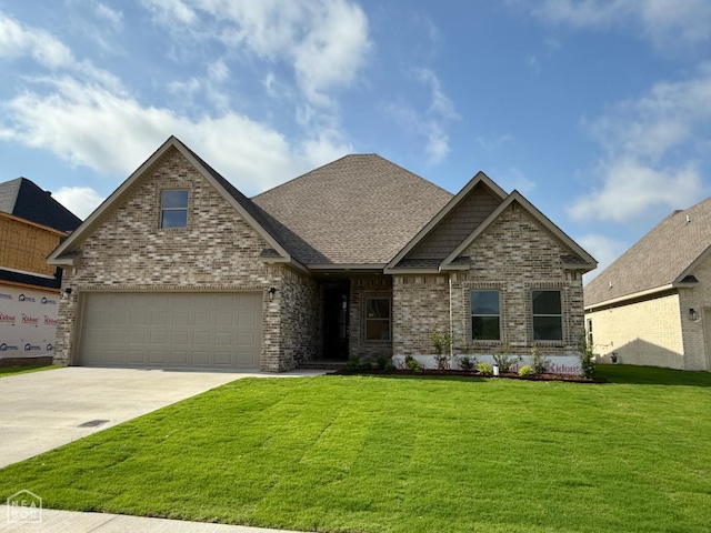 3101 Bear Creek Cv, Jonesboro, AR 72404 - craftsman-style home featuring brick siding, concrete driveway, a front lawn, an attached garage, and roof with shingles