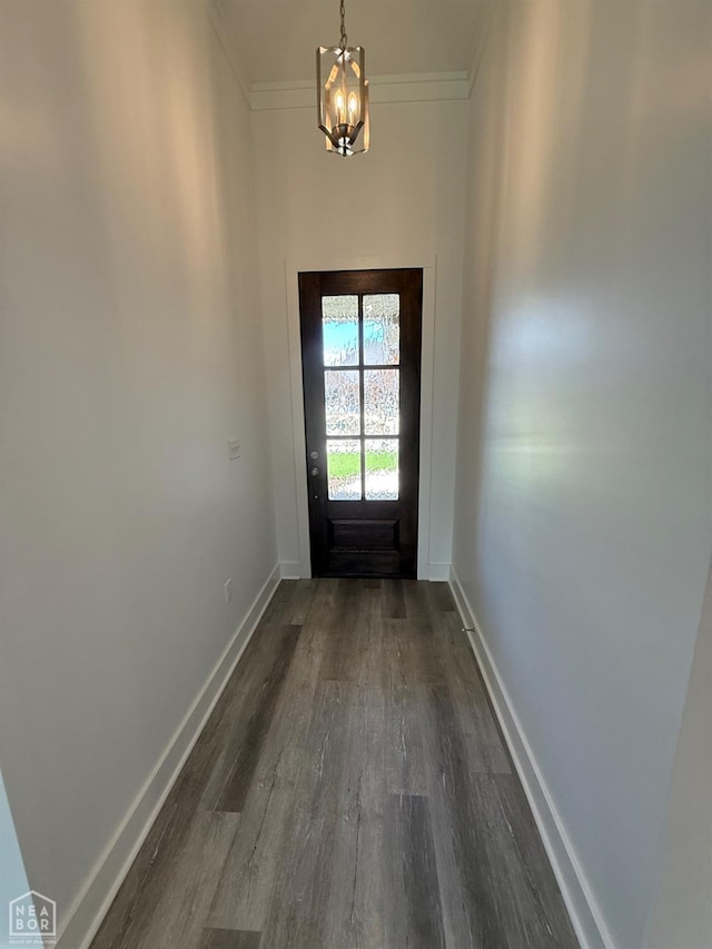 3101 Bear Creek Cv, Jonesboro, AR 72404 - entryway featuring dark wood-style flooring, a chandelier, and crown molding