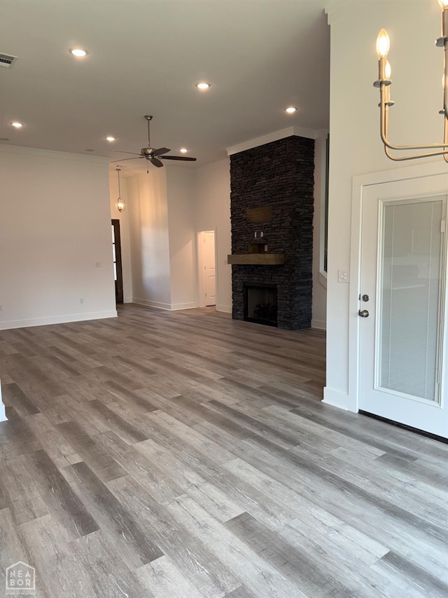 3101 Bear Creek Cv, Jonesboro, AR 72404 - unfurnished living room featuring ceiling fan, wood finished floors, a fireplace, and recessed lighting