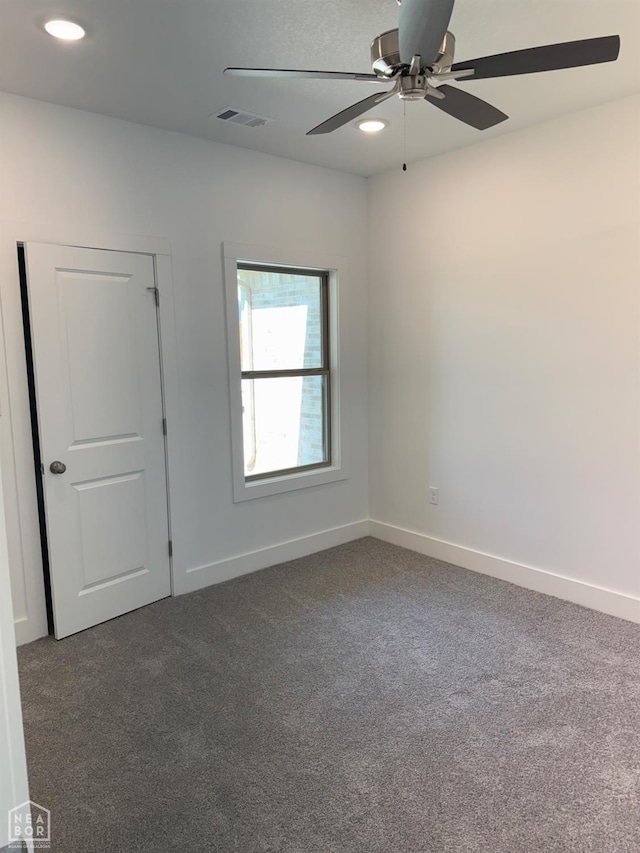 3101 Bear Creek Cv, Jonesboro, AR 72404 - empty room featuring dark carpet, ceiling fan, and recessed lighting